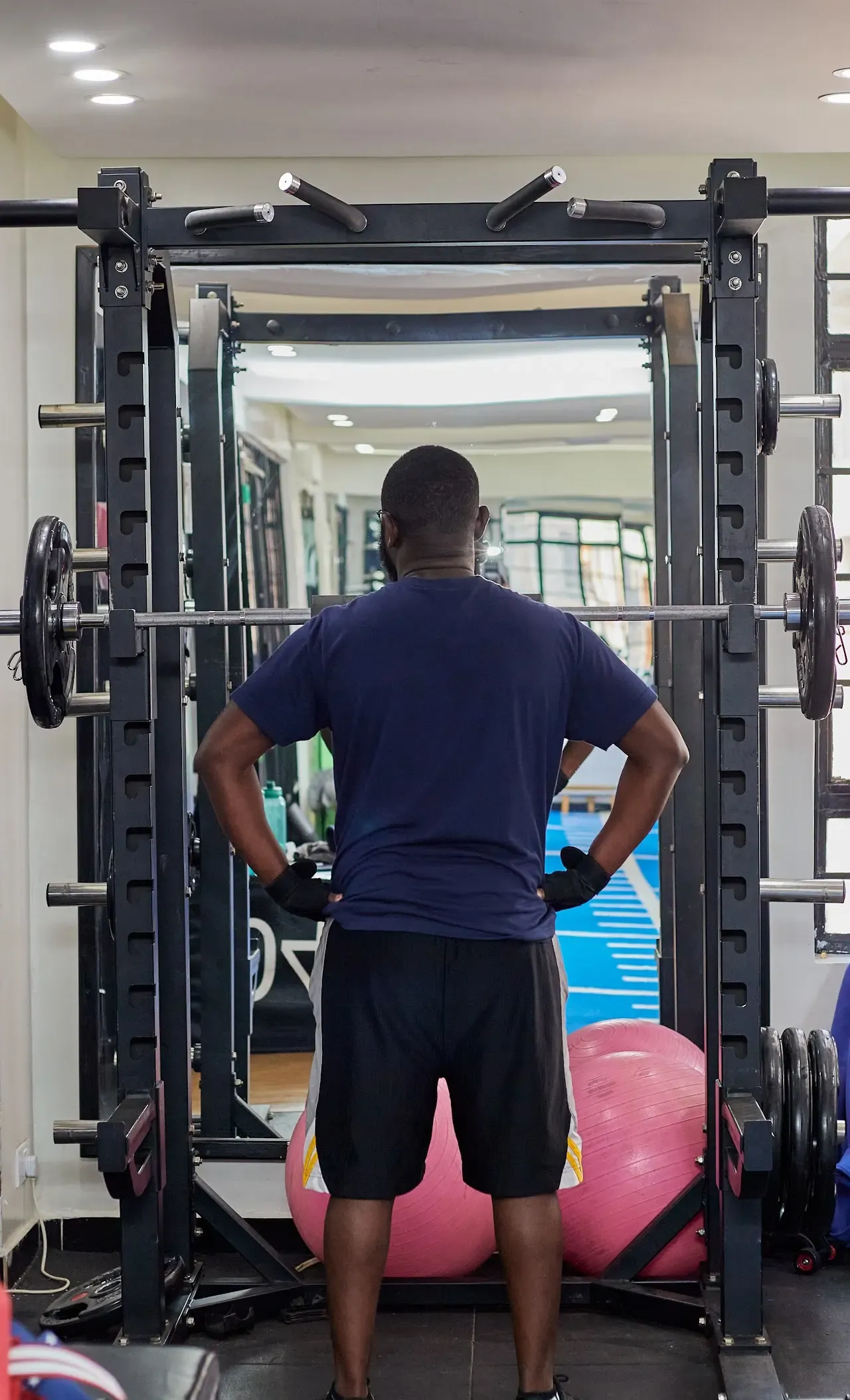The Batman Fitness Gym floor, weight racks and resistance machinery in Minstan Towers Ruaka